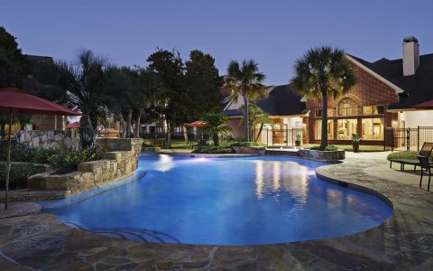 Swimming Pool at Night at Camden Sugar Grove Apartments in Stafford, Texas