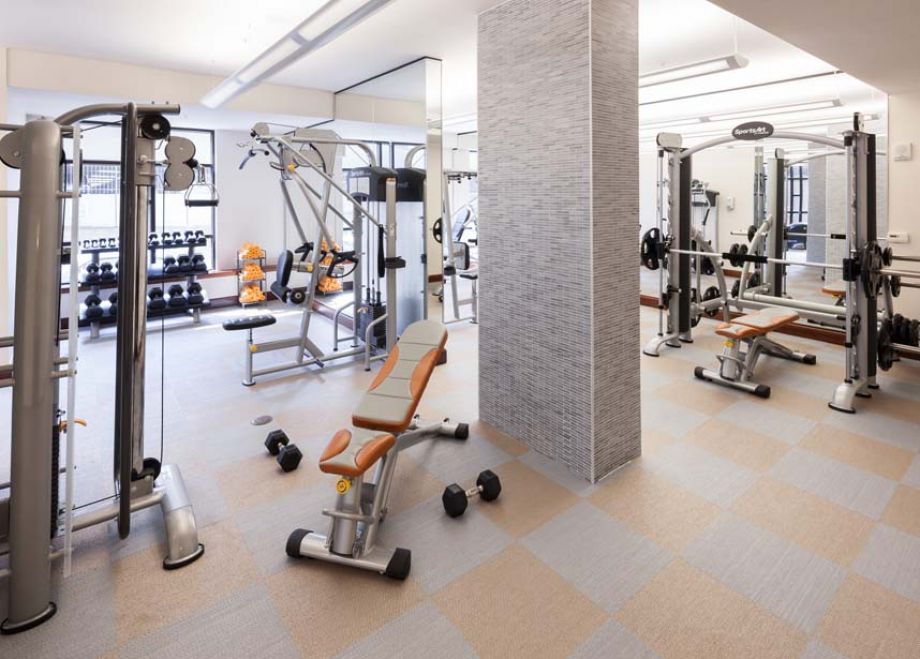 Fitness Center with Cardio Equipment and Free Weights at Camden Post Oak High Rise Luxury Apartments in Houston Galleria, Texas