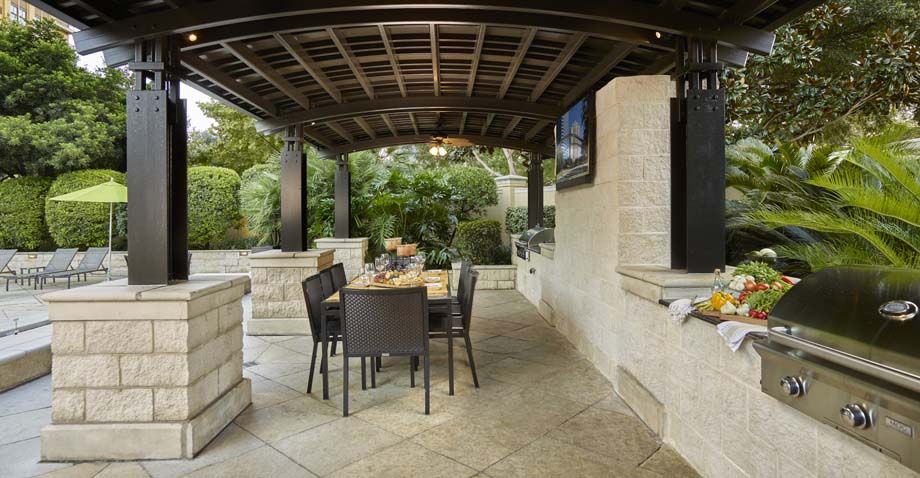 Outdoor Grilling Station with Covered Dining Areas and Flat Screen TV at Camden Post Oak High Rise Luxury Apartments in Houston Galleria, Texas