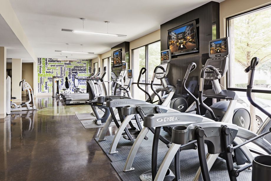 Fitness center with cardio machines at Camden Belmont apartments in Dallas, TX