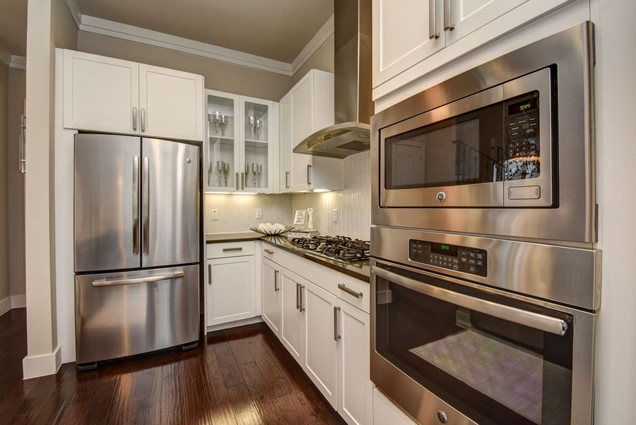 Kitchen with stainless steel appliances at Camden Highland Village townhomes in Houston, TX