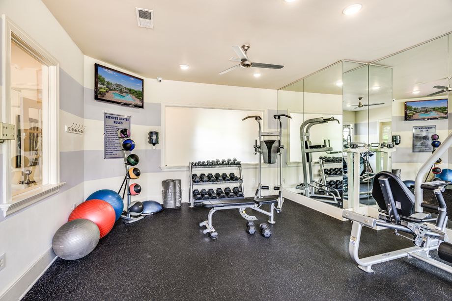 Fitness center with free weights at Camden Governors Village Apartments in Chapel Hill, NC