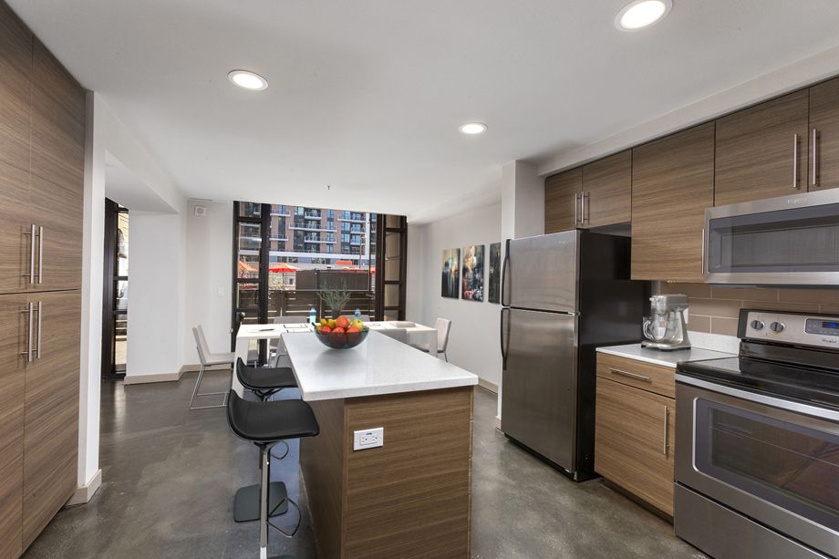 Kitchen with stainless steel appliances at Camden Harbor View Live/Work Apartments in Long Beach, CA