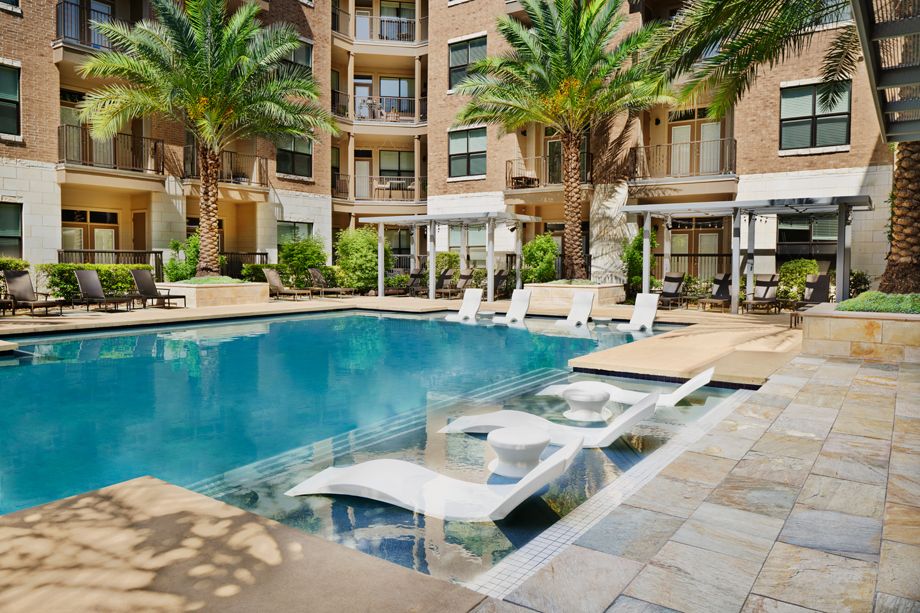 Pool with in-water lounge chairs at Camden Lamar Heights in Austin, TX