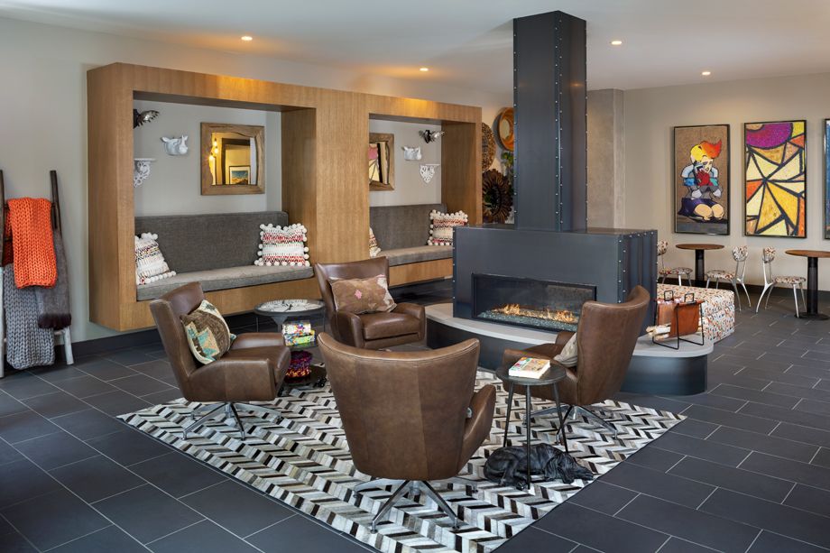 Camden RiNo apartments in Denver, Colorado live work resident lounge with fireplace
