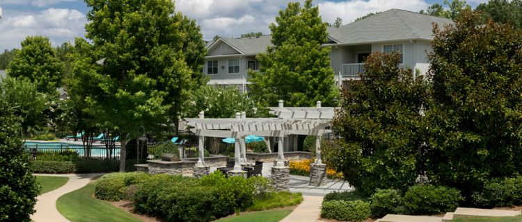 camden stockbridge pool and cabana surrounded by trees