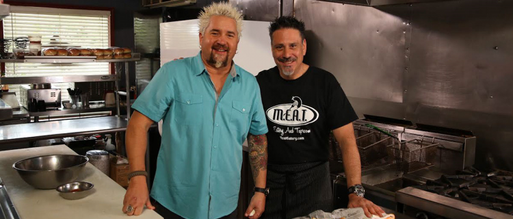 • Chef George Patti and Guy Fieri on set for Diners, Drive-ins and Dives (Season 24, Episode 8: “Hot Meat and Cool Veg” aired April 22, 2016) pictured with Housemade Pork Rinds and Chimichurri Aioli; photo courtesy of M.E.A.T. Eatery And Taproom • Chef George Patti and Guy Fieri on set for Diners, Drive-ins and Dives (Season 24, Episode 8: “Hot Meat and Cool Veg” aired April 22, 2016) pictured with Housemade Pork Rinds and Chimichurri Aioli; photo courtesy of M.E.A.T. Eatery And Taproom