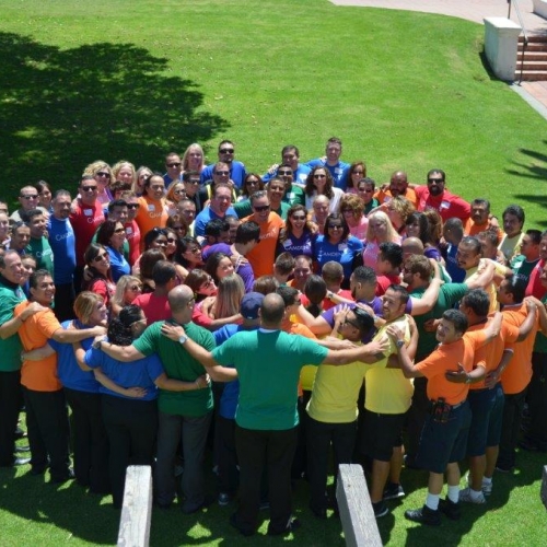 Camden employees enjoying a group hug